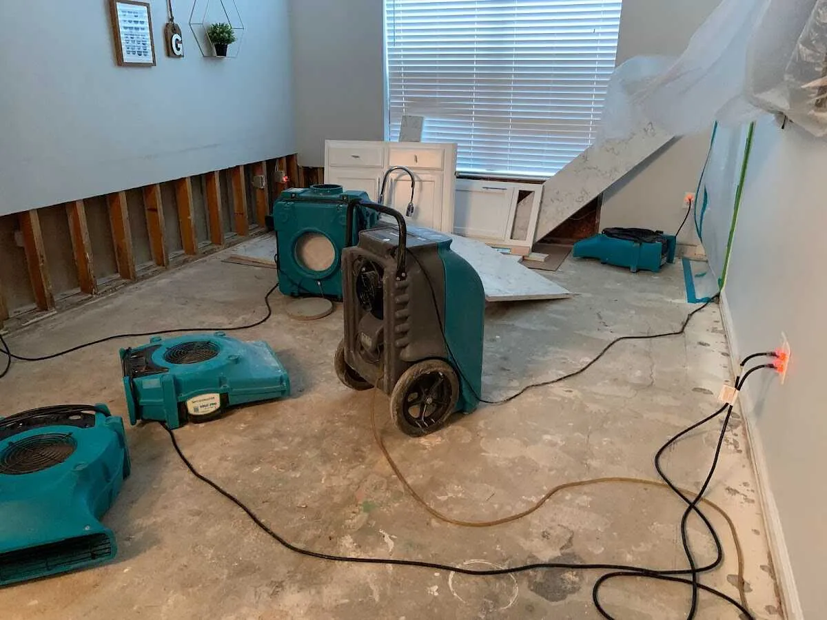 Dehumidifier in flood-cut room for Water Damage Restoration in Keene